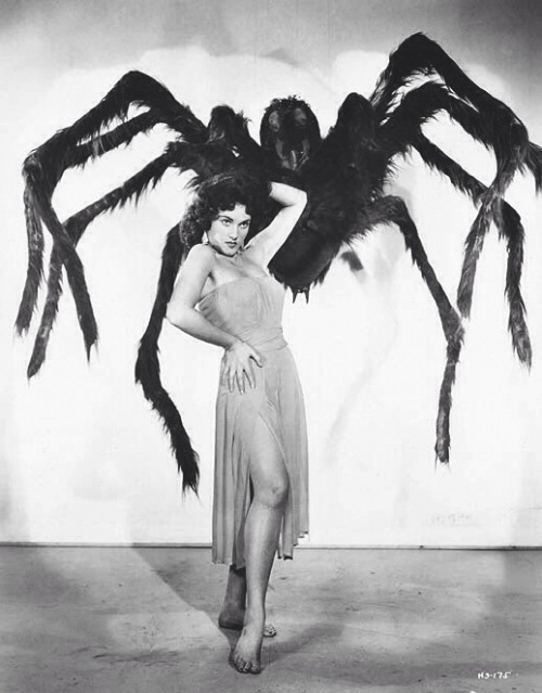 Woman holding a big spider 1920s style