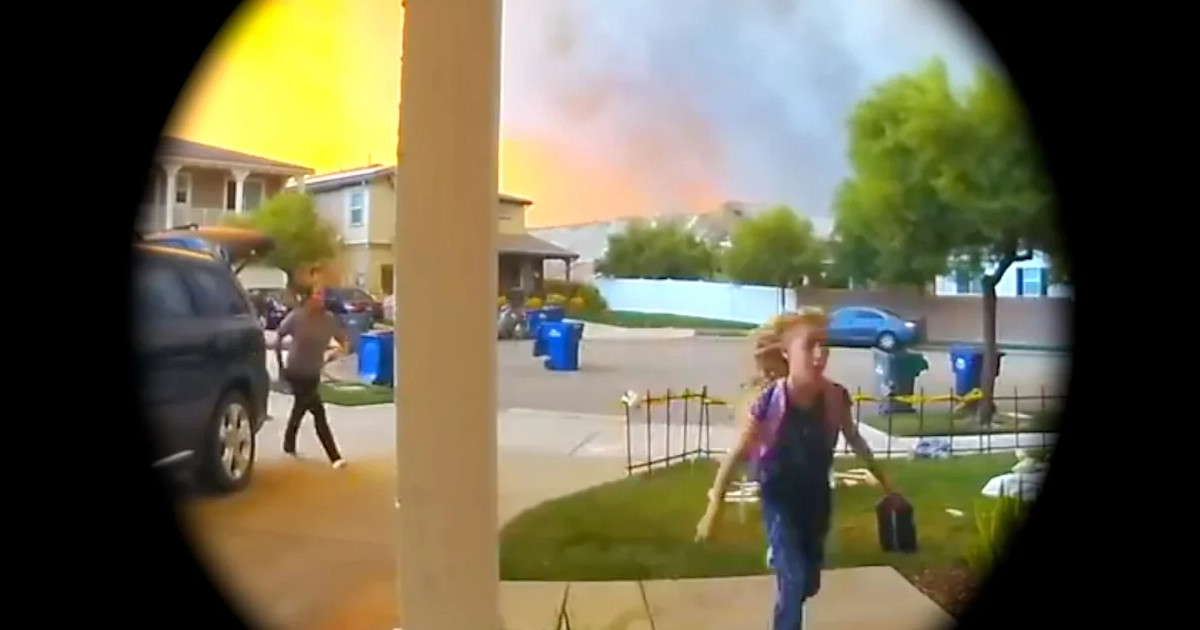 Scene shown through a doorbell circle of a girl running to the front door