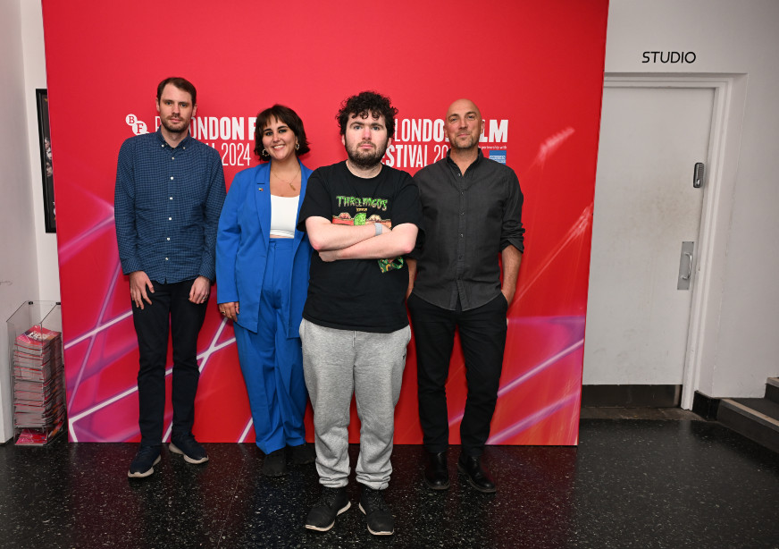 Group of four people in front of London Film Festival banner