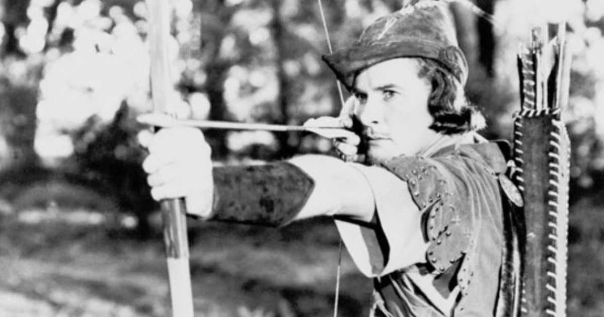 Robin hood man in tights with a bow and arrow